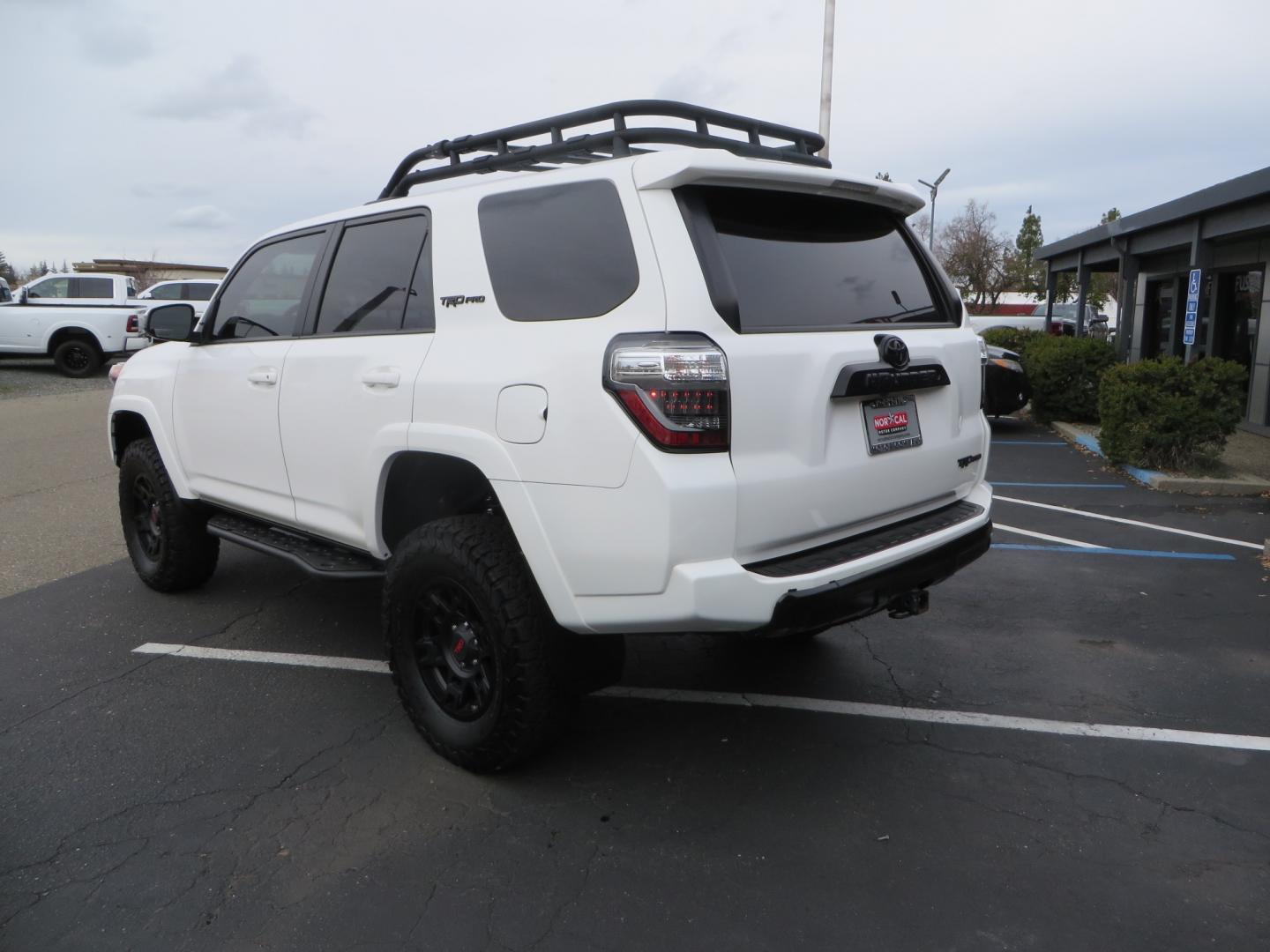 2019 White /BLACK Toyota 4Runner TRD Pro (JTEBU5JR3K5) with an 4.0L V6 engine, 5 -Speed Automatic transmission, located at 2630 Grass Valley Highway, Auburn, CA, 95603, (530) 508-5100, 38.937893, -121.095482 - Features Ironman 4X4 suspension, BFG tires, Rockslider, Roof rack, window tint, and interior Rago Fab Molle storage racks. - Photo#6